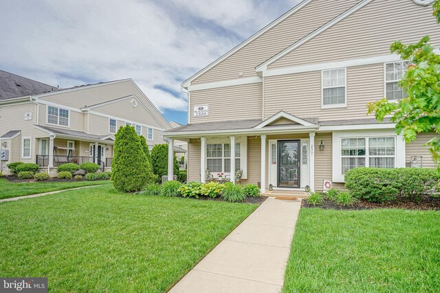 2501 Lexington Mews, Woolwich Twp, NJ 08085 - view of front of house with covered porch and a front yard