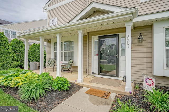 2501 Lexington Mews, Woolwich Twp, NJ 08085 - doorway to property with a porch and central air condition unit