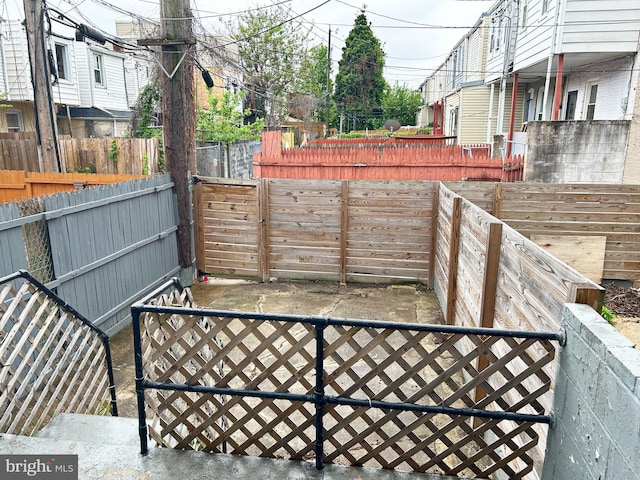 view of patio / terrace featuring fence