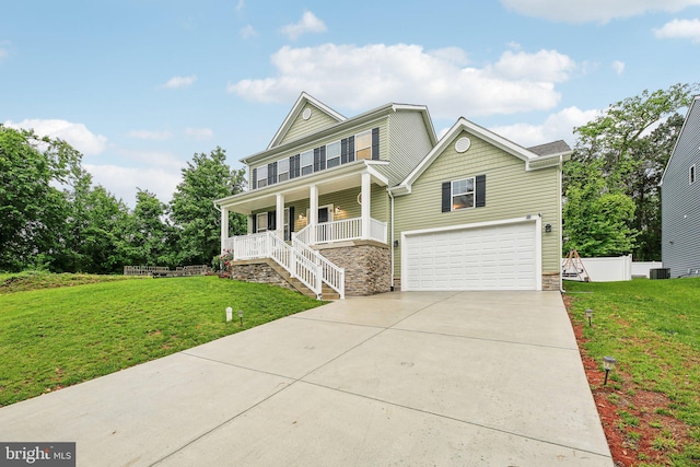 4202 Louisa Ave, Nottingham, MD 21236 - view of front of house featuring a porch, a garage, stone siding, and a front lawn