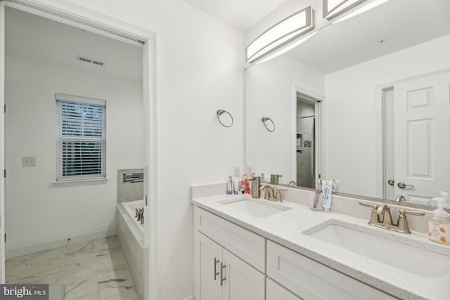 4202 Louisa Ave, Nottingham, MD 21236 - full bath featuring marble finish flooring, baseboards, double vanity, and a bathtub