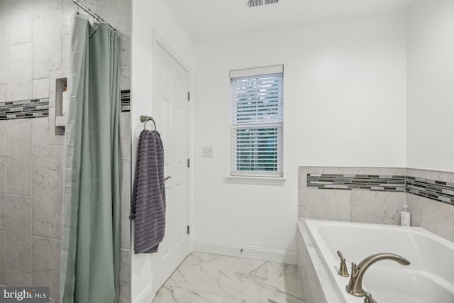 4202 Louisa Ave, Nottingham, MD 21236 - full bath featuring a garden tub, marble look tile flooring, and baseboards