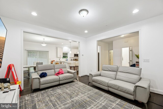 4202 Louisa Ave, Nottingham, MD 21236 - living area with dark wood-type flooring, recessed lighting, and baseboards