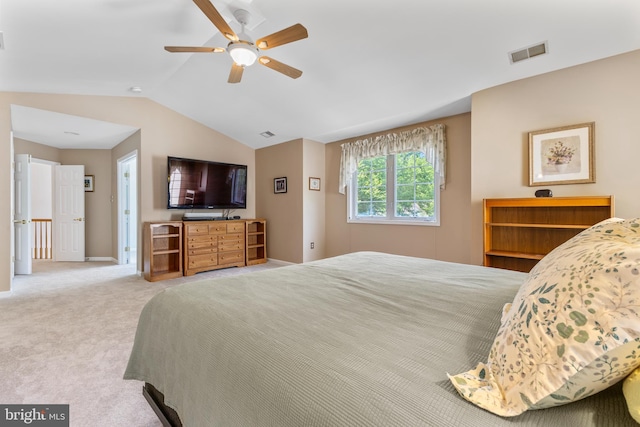 bedroom featuring lofted ceiling, carpet, baseboards, and a ceiling fan