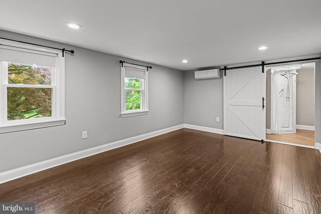 3082 Limekiln Pike, Glenside, PA 19038 - below grade area with a wall unit AC, a barn door, wood finished floors, baseboards, and recessed lighting