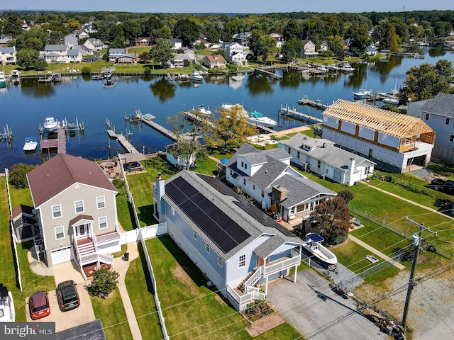 aerial perspective of suburban area featuring a nearby body of water