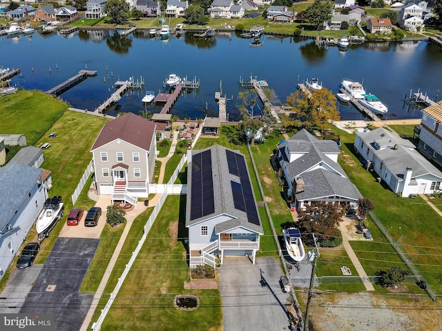 aerial view of residential area featuring a nearby body of water