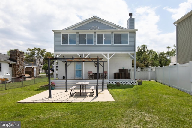 rear view of house featuring a patio and a chimney
