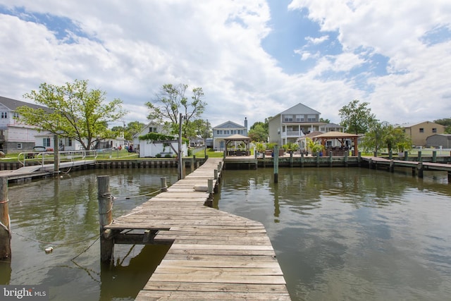 dock with a water view and a residential view