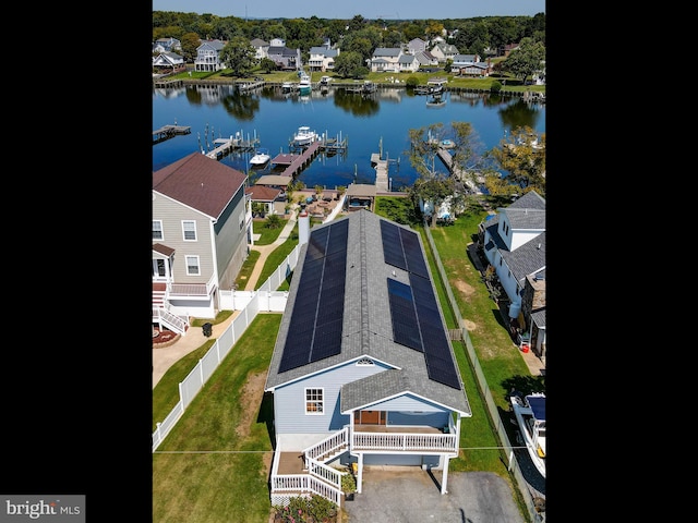 aerial perspective of suburban area with a nearby body of water