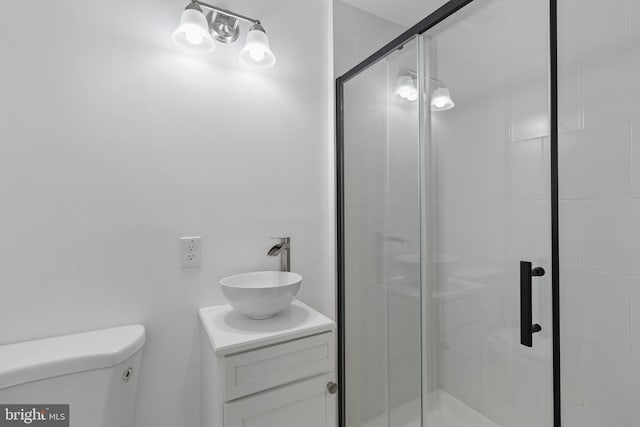 2514 Ashland Ave, Baltimore, MD 21205 - bathroom featuring toilet, a stall shower, and vanity