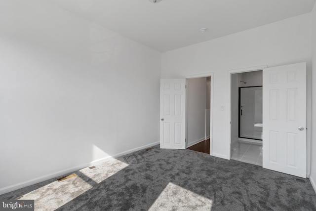 2514 Ashland Ave, Baltimore, MD 21205 - unfurnished bedroom featuring carpet flooring, baseboards, and ensuite bathroom
