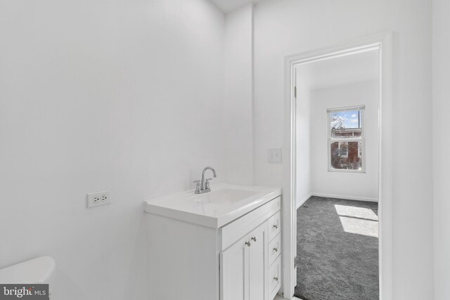 2514 Ashland Ave, Baltimore, MD 21205 - bathroom with vanity, toilet, and baseboards