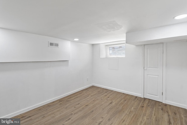 2514 Ashland Ave, Baltimore, MD 21205 - below grade area featuring wood finished floors, baseboards, and recessed lighting