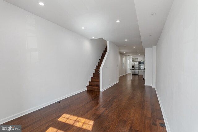 2514 Ashland Ave, Baltimore, MD 21205 - hall with recessed lighting, dark wood-style floors, stairway, and baseboards