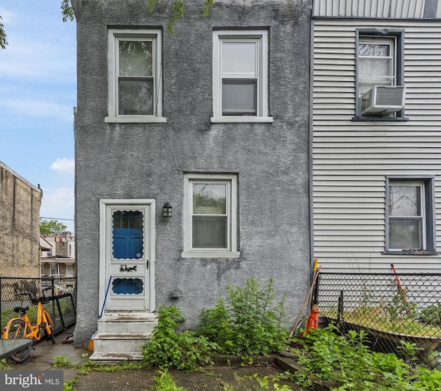 2022 Rowan St, Philadelphia, PA 19140 - view of property featuring stucco siding and cooling unit