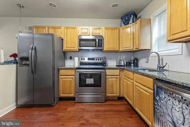 2458 N Natrona St, Philadelphia, PA 19132 - kitchen with appliances with stainless steel finishes, a sink, tasteful backsplash, dark wood finished floors, and recessed lighting