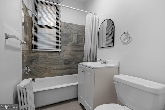 full bath with radiator, toilet, vanity, and shower / tub combo with curtain
