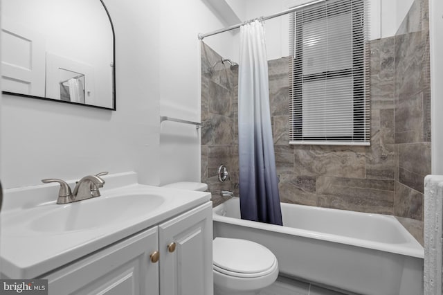full bath with toilet, shower / bath combo, and vanity