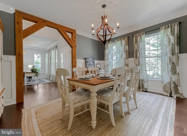 11372 Wollaston, Swan Point, MD 20645 - dining room with a decorative wall, a chandelier, healthy amount of natural light, a wainscoted wall, and ornamental molding