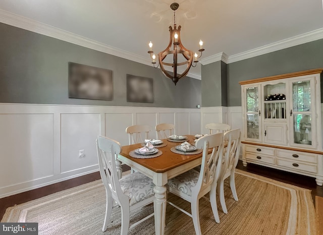 11372 Wollaston, Swan Point, MD 20645 - dining area with a decorative wall, a chandelier, wood finished floors, crown molding, and a wainscoted wall