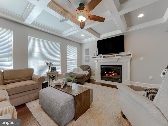 11372 Wollaston, Swan Point, MD 20645 - living room with coffered ceiling, a ceiling fan, a glass covered fireplace, wood finished floors, and beam ceiling