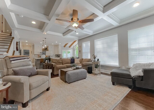 11372 Wollaston, Swan Point, MD 20645 - living area with coffered ceiling, beam ceiling, wood finished floors, stairway, and ceiling fan