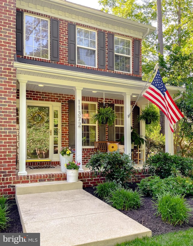 11372 Wollaston, Swan Point, MD 20645 - entrance to property with covered porch and brick siding