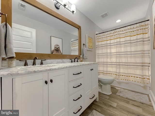 11372 Wollaston, Swan Point, MD 20645 - full bathroom with toilet, wood finished floors, double vanity, shower / tub combo with curtain, and recessed lighting