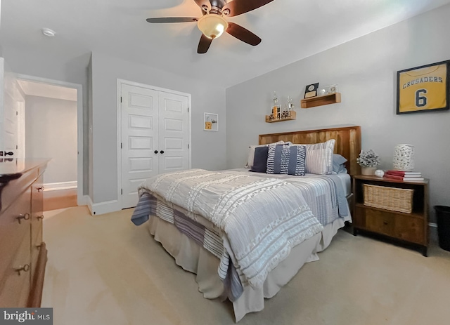 11372 Wollaston, Swan Point, MD 20645 - bedroom featuring light carpet, a closet, a ceiling fan, and baseboards