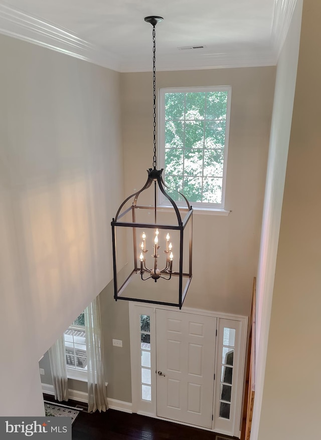 11372 Wollaston, Swan Point, MD 20645 - foyer with a chandelier, crown molding, healthy amount of natural light, and baseboards