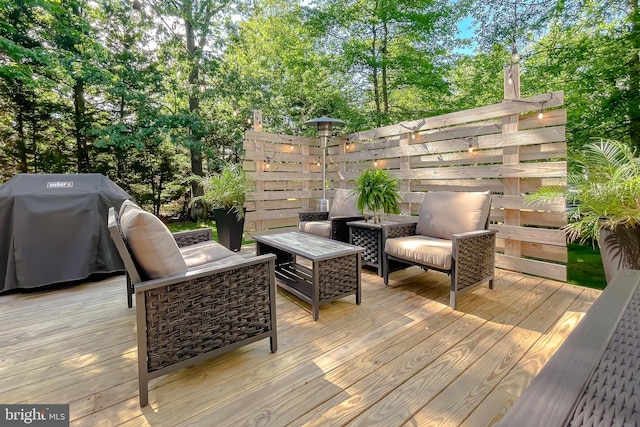 11372 Wollaston, Swan Point, MD 20645 - wooden terrace with outdoor lounge area and view of wooded area