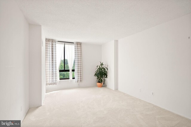 1800 Old Meadow Rd Unit 1218, Mclean, VA 22102 - empty room featuring carpet floors and a textured ceiling