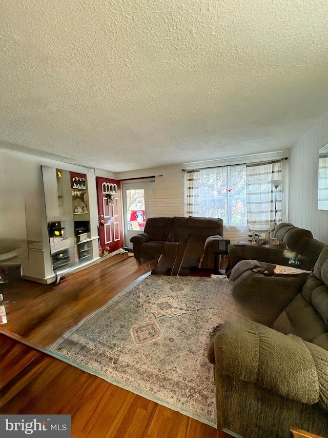 3630 Keystone Ave, Baltimore, MD 21211 - living room with a textured ceiling, wood finished floors, and built in features