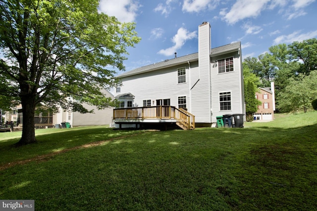 back of property featuring a lawn, a wooden deck, and a chimney