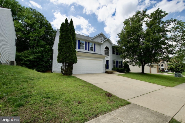 view of front of property with a garage, concrete driveway, and a front lawn