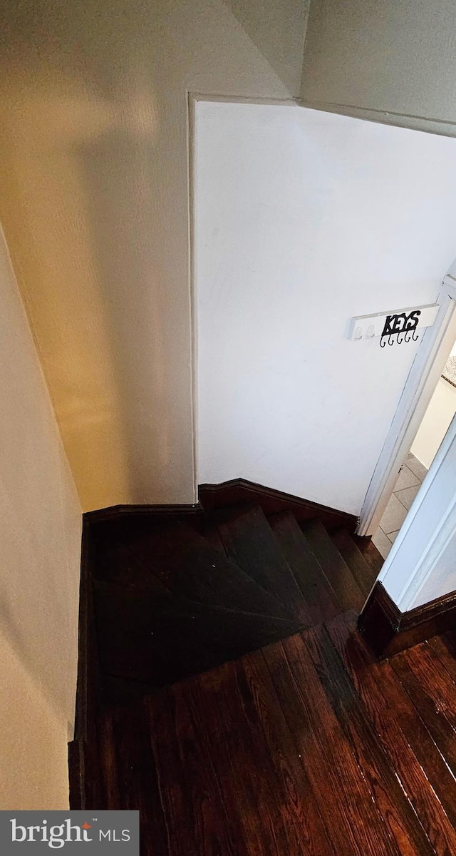 stairs with wood finished floors