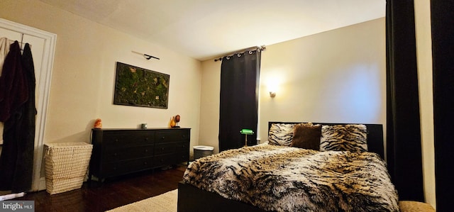 bedroom with wood finished floors