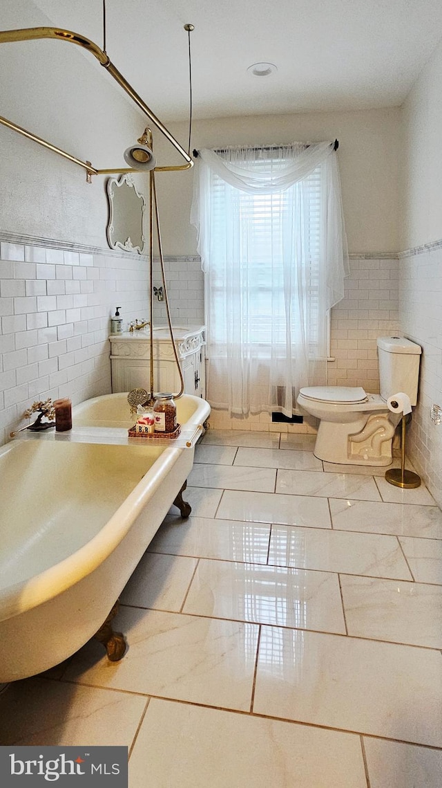 full bathroom featuring tile walls, toilet, and tile patterned floors