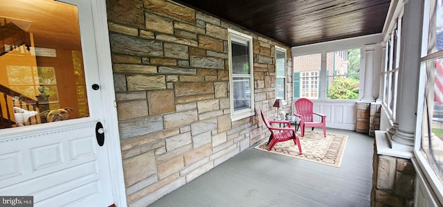 sunroom / solarium with wood finished floors and wood ceiling