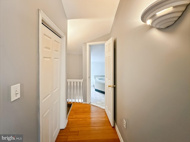 hall with wood finished floors