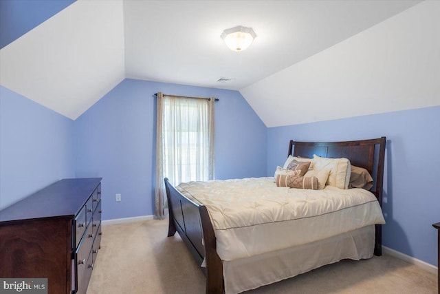 304 Iron Valley Dr, Lebanon, PA 17042 - bedroom featuring lofted ceiling, light carpet, and baseboards