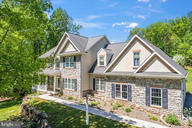 304 Iron Valley Dr, Lebanon, PA 17042 - craftsman-style home featuring stone siding, stucco siding, and a front lawn