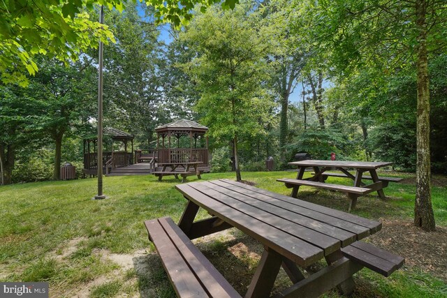 view of property's community with a gazebo and a lawn