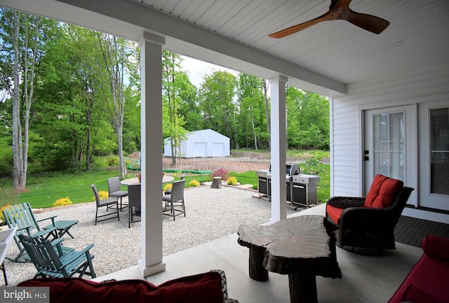 130 Schultz Rd, Sellersville, PA 18960 - view of patio featuring outdoor dining space, ceiling fan, area for grilling, and an outbuilding