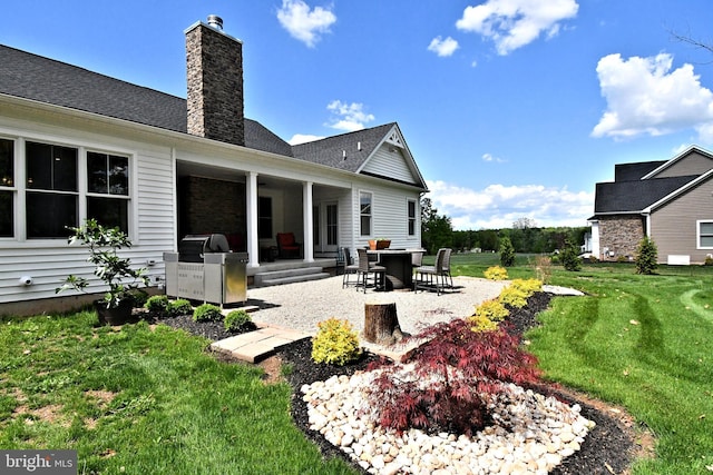 130 Schultz Rd, Sellersville, PA 18960 - back of house featuring a chimney, a patio, and a yard