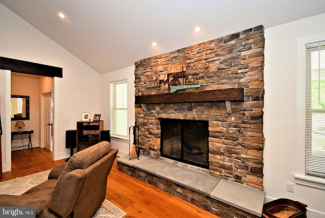 130 Schultz Rd, Sellersville, PA 18960 - living area featuring a stone fireplace, wood finished floors, lofted ceiling, and recessed lighting