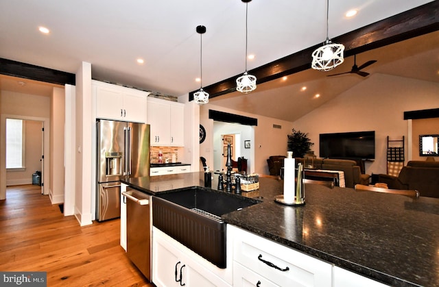 130 Schultz Rd, Sellersville, PA 18960 - kitchen with stainless steel appliances, light wood-type flooring, hanging light fixtures, open floor plan, and white cabinets