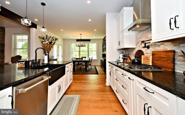 130 Schultz Rd, Sellersville, PA 18960 - kitchen with stainless steel appliances, wall chimney range hood, a sink, recessed lighting, and white cabinetry