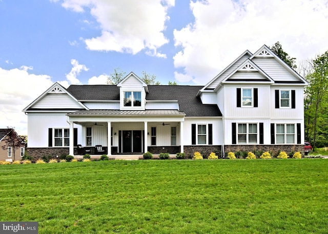 130 Schultz Rd, Sellersville, PA 18960 - view of front of property featuring a ceiling fan, a standing seam roof, a front lawn, and stone siding